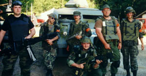 Team Acid For Blood poses next to the APC.